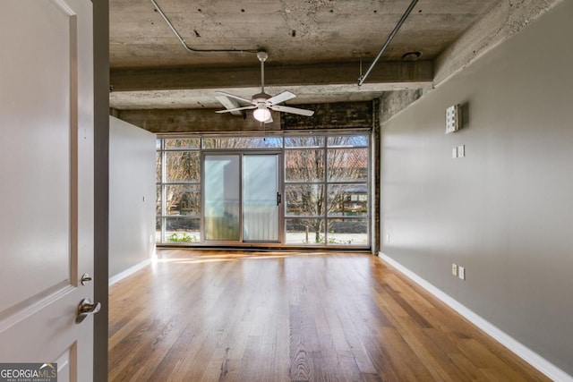890 Memorial Dr SE Unit 105, Atlanta, GA 30316 - spare room featuring hardwood / wood-style floors, a ceiling fan, healthy amount of natural light, and baseboards