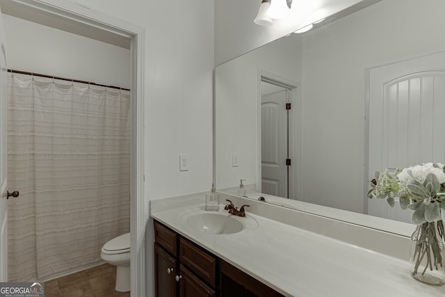full bath with toilet, vanity, tile patterned floors, and curtained shower