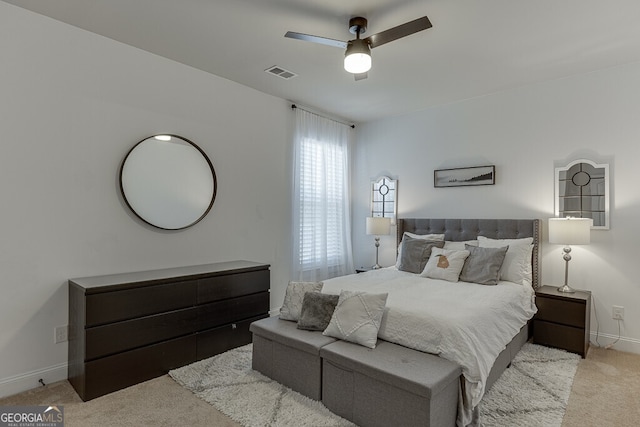carpeted bedroom with baseboards and ceiling fan