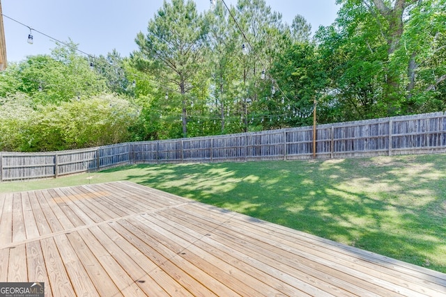 wooden terrace with view of scattered trees