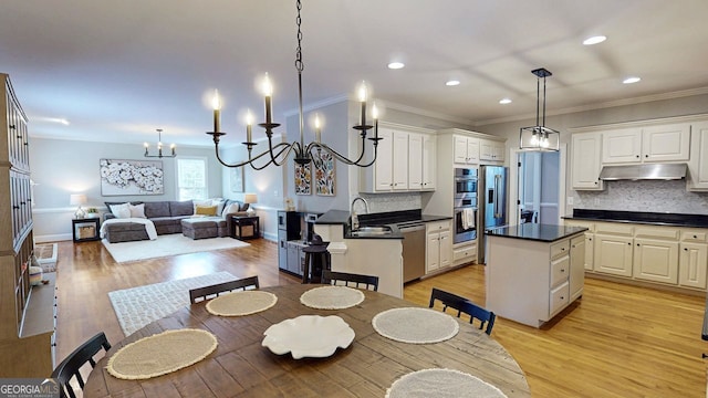 200 N Willow Ct, Alpharetta, GA 30004 - dining area with recessed lighting, light wood finished floors, crown molding, and a chandelier