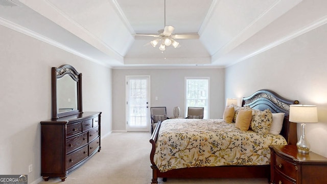 200 N Willow Ct, Alpharetta, GA 30004 - bedroom with light colored carpet, ornamental molding, a tray ceiling, and a ceiling fan