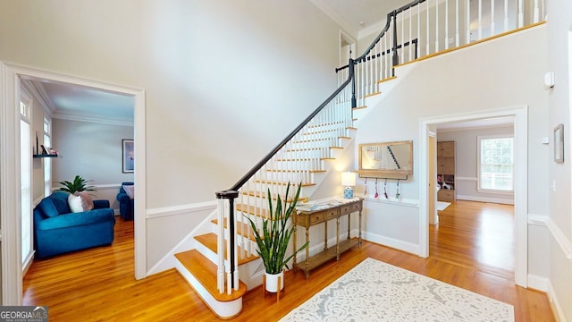200 N Willow Ct, Alpharetta, GA 30004 - stairs featuring ornamental molding, wood finished floors, and a high ceiling