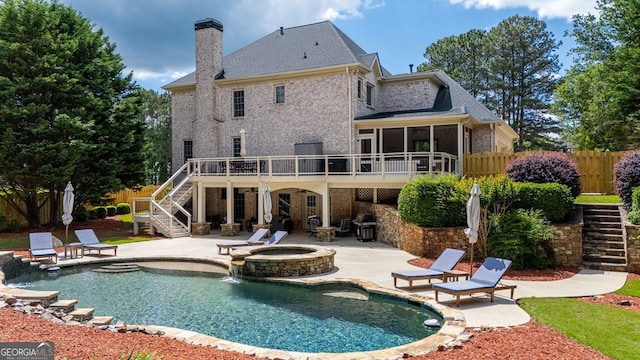 200 N Willow Ct, Alpharetta, GA 30004 - rear view of property featuring stairway, a chimney, a patio area, a sunroom, and a wooden deck