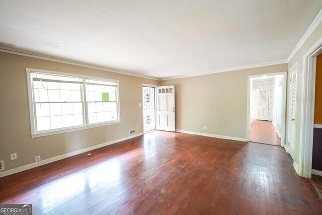 1443 Snapfinger Rd, Decatur, GA 30032 - empty room featuring wood finished floors, baseboards, and ornamental molding