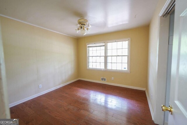 1443 Snapfinger Rd, Decatur, GA 30032 - spare room featuring wood finished floors, baseboards, and a ceiling fan