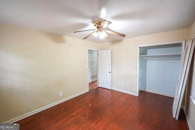 1443 Snapfinger Rd, Decatur, GA 30032 - unfurnished bedroom with wood finished floors, baseboards, and a closet