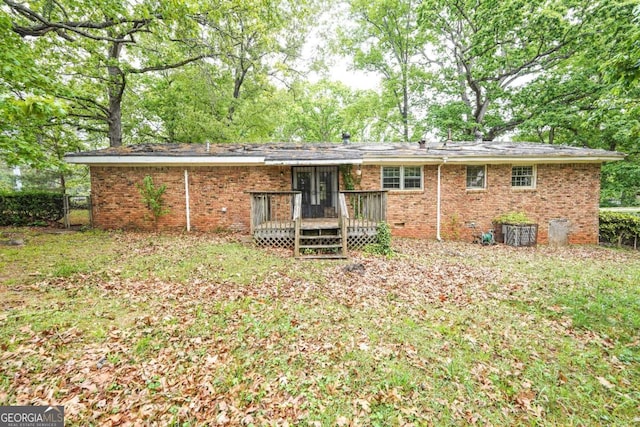 1443 Snapfinger Rd, Decatur, GA 30032 - back of house with a deck, brick siding, crawl space, french doors, and fence