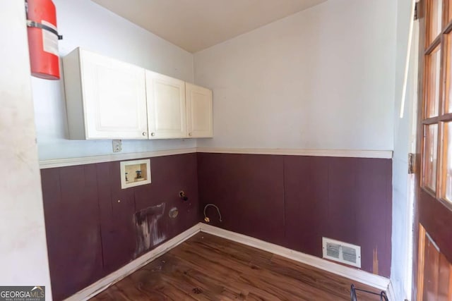 1443 Snapfinger Rd, Decatur, GA 30032 - laundry room featuring cabinet space, washer hookup, dark wood-type flooring, and gas dryer hookup