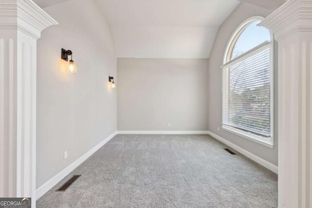 5034 Hickory Hills Dr, Woodstock, GA 30188 - empty room featuring carpet flooring, healthy amount of natural light, vaulted ceiling, and baseboards