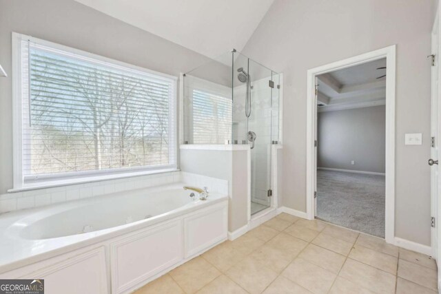 5034 Hickory Hills Dr, Woodstock, GA 30188 - bathroom with healthy amount of natural light, a bath, a shower stall, and tile patterned floors