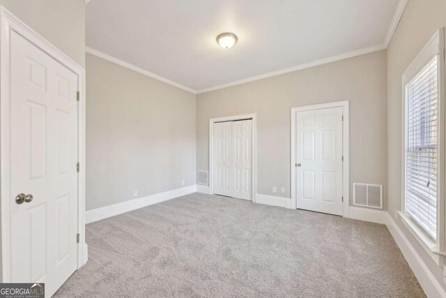 5034 Hickory Hills Dr, Woodstock, GA 30188 - unfurnished bedroom with carpet floors, ornamental molding, and baseboards