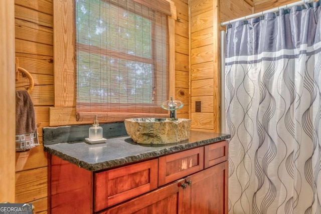 440 Treat Mountain Rd, Cedartown, GA 30125 - bathroom with vanity, curtained shower, and wood walls