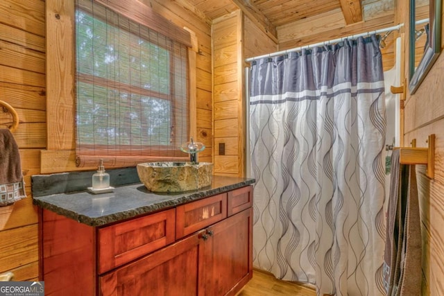 440 Treat Mountain Rd, Cedartown, GA 30125 - full bathroom with wood ceiling, wooden walls, vanity, wood finished floors, and a shower with shower curtain