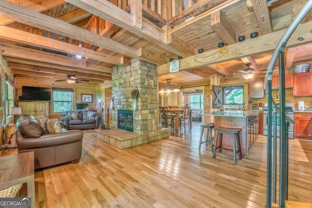 440 Treat Mountain Rd, Cedartown, GA 30125 - living room with ceiling fan, light wood-type flooring, beamed ceiling, healthy amount of natural light, and wooden ceiling