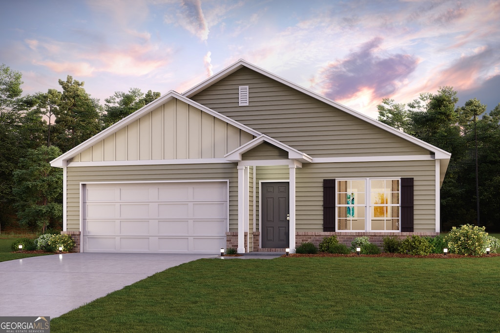 131 Pinehurst Ct, Dublin, GA 31021 - view of front of home featuring concrete driveway, brick siding, a front yard, board and batten siding, and an attached garage