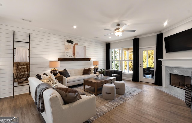 2608 Turnwater St, Hoschton, GA 30548 - living area featuring ceiling fan, a premium fireplace, crown molding, wood finished floors, and recessed lighting