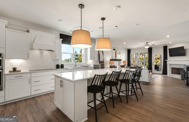 2608 Turnwater St, Hoschton, GA 30548 - kitchen featuring open floor plan, a kitchen island, black electric stovetop, backsplash, and recessed lighting