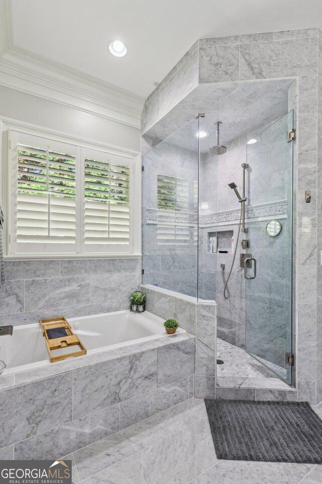 895 Freemanwood Ln, Milton, GA 30004 - bathroom with crown molding, a stall shower, a bath, and tile patterned floors