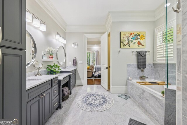 895 Freemanwood Ln, Milton, GA 30004 - bathroom featuring crown molding, vanity, a garden tub, connected bathroom, and baseboards