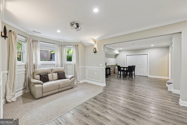 895 Freemanwood Ln, Milton, GA 30004 - living area with wood finished floors, ornamental molding, recessed lighting, a fireplace, and wainscoting