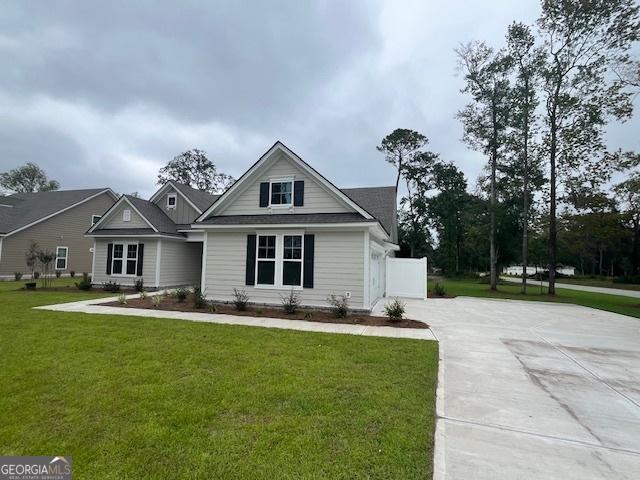 352 Harbour Island Cir, Waverly, GA 31565 - view of front of home with a front lawn and driveway