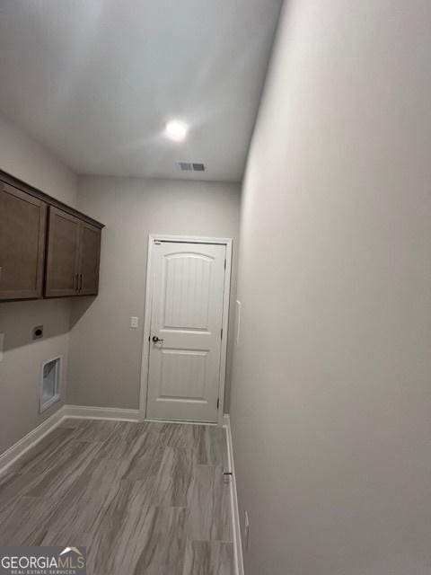 352 Harbour Island Cir, Waverly, GA 31565 - clothes washing area with cabinet space, electric dryer hookup, and baseboards