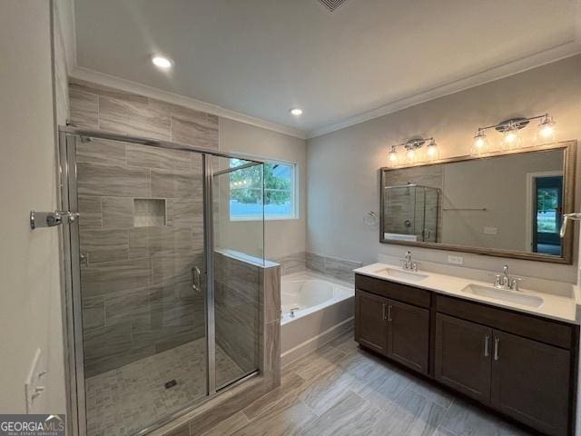 352 Harbour Island Cir, Waverly, GA 31565 - bathroom featuring crown molding, a garden tub, a stall shower, and double vanity