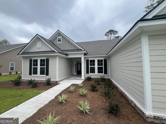 352 Harbour Island Cir, Waverly, GA 31565 - view of front of property with board and batten siding