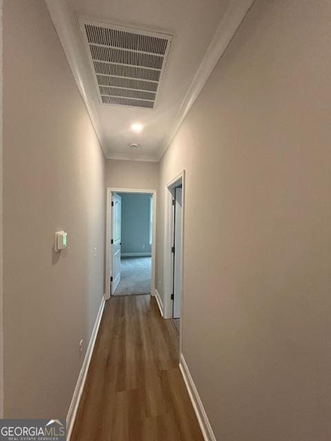 352 Harbour Island Cir, Waverly, GA 31565 - hall with wood finished floors, baseboards, and crown molding