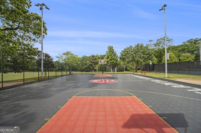 387 Skylar Way SE, Atlanta, GA 30315 - view of sport court featuring community basketball court, fence, and view of wooded area