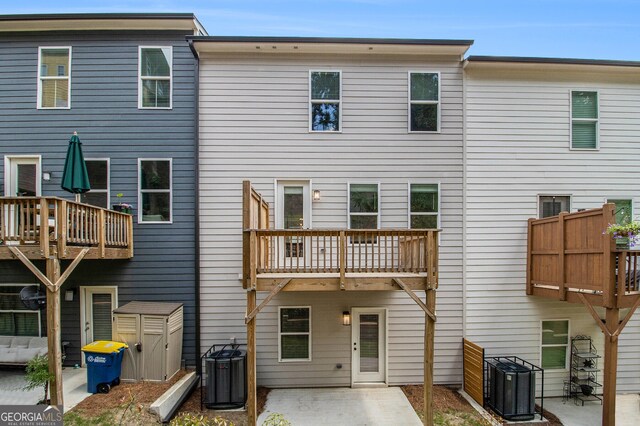 387 Skylar Way SE, Atlanta, GA 30315 - back of property with cooling unit, a balcony, and a patio area
