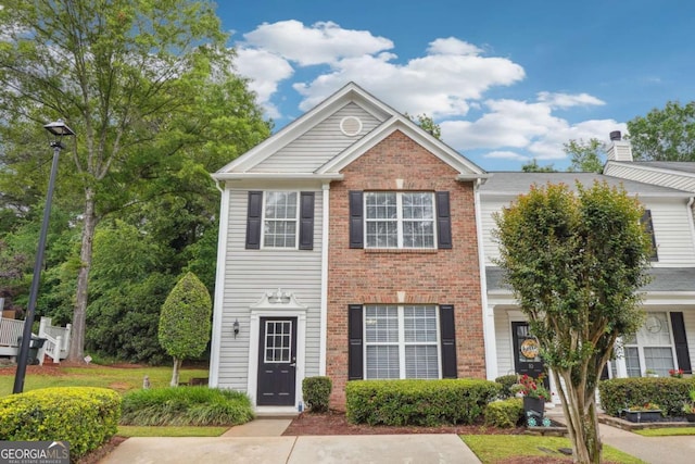 9165 Nesbit Ferry Rd # 9, Alpharetta, GA 30022 - view of front of property with brick siding and a chimney