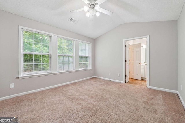9165 Nesbit Ferry Rd # 9, Alpharetta, GA 30022 - unfurnished bedroom with light colored carpet, vaulted ceiling, connected bathroom, a ceiling fan, and a textured ceiling