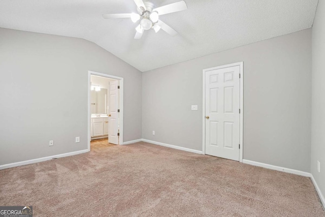 9165 Nesbit Ferry Rd # 9, Alpharetta, GA 30022 - unfurnished bedroom featuring light colored carpet, vaulted ceiling, connected bathroom, and a ceiling fan