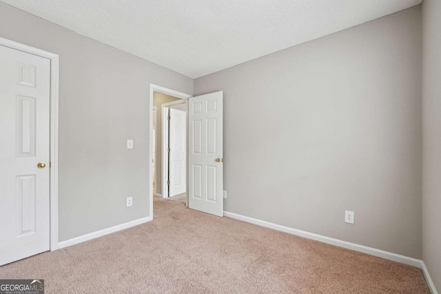 9165 Nesbit Ferry Rd # 9, Alpharetta, GA 30022 - unfurnished bedroom with carpet flooring and baseboards