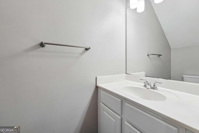 9165 Nesbit Ferry Rd # 9, Alpharetta, GA 30022 - bathroom featuring vanity and vaulted ceiling