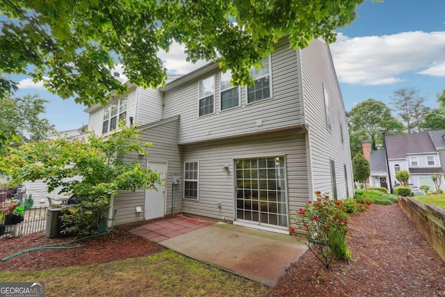 9165 Nesbit Ferry Rd # 9, Alpharetta, GA 30022 - rear view of property with a patio