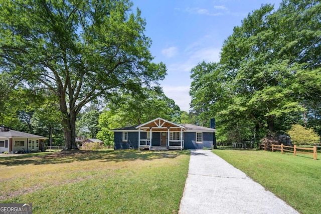 3770 Ponderosa Ln, Powder Springs, GA 30127 - ranch-style house with driveway and view of scattered trees