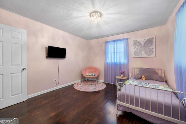 3770 Ponderosa Ln, Powder Springs, GA 30127 - bedroom with wood-type flooring and baseboards