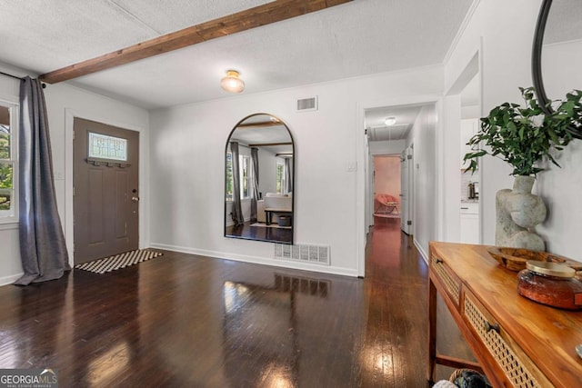 3770 Ponderosa Ln, Powder Springs, GA 30127 - entrance foyer with wood finished floors, arched walkways, beam ceiling, baseboards, and a textured ceiling
