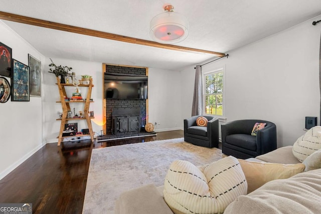 3770 Ponderosa Ln, Powder Springs, GA 30127 - living area with dark wood-style floors, baseboards, beam ceiling, and a fireplace