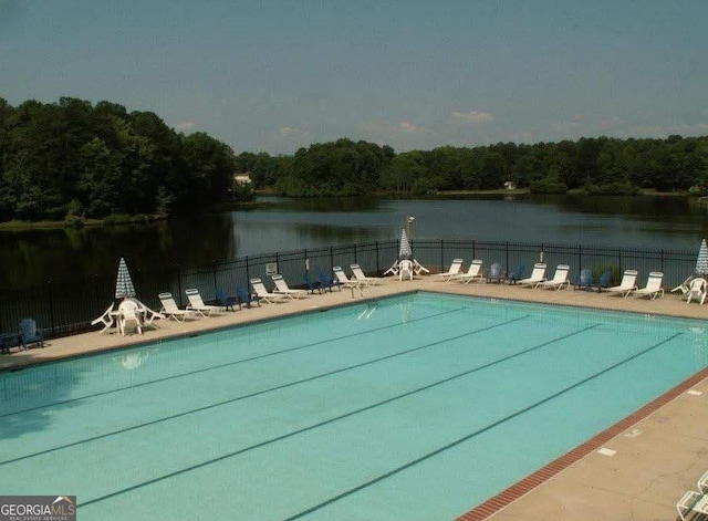 526 Lakeside Dr, Hiram, GA 30141 - community pool with fence, a water view, and a patio