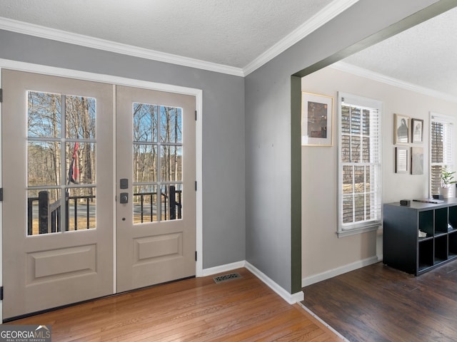 526 Lakeside Dr, Hiram, GA 30141 - entrance foyer featuring wood finished floors, baseboards, a textured ceiling, and ornamental molding