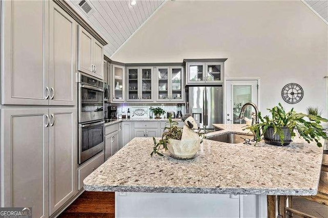 163 Thompson Ln, Jasper, GA 30143 - kitchen with a sink, stainless steel appliances, vaulted ceiling, wooden ceiling, and light stone countertops