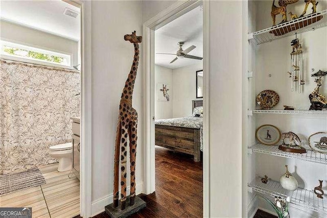 163 Thompson Ln, Jasper, GA 30143 - bathroom featuring ceiling fan, toilet, and wood finished floors