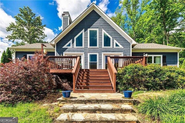 163 Thompson Ln, Jasper, GA 30143 - rear view of house with stairway, a wooden deck, and a chimney