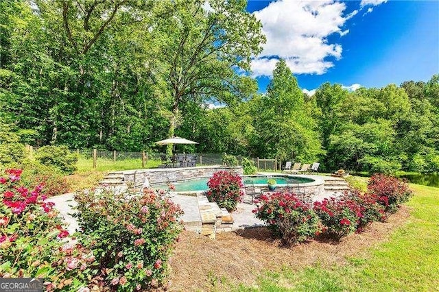 163 Thompson Ln, Jasper, GA 30143 - view of swimming pool featuring fence, a patio, and a view of trees