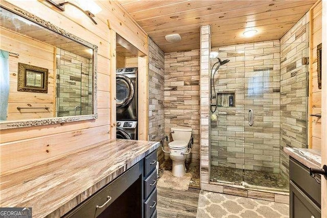 163 Thompson Ln, Jasper, GA 30143 - full bath with vanity, wood ceiling, a shower stall, wooden walls, and estacked washer and dryer