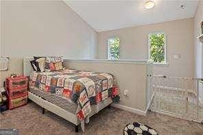 210 Cottonwood Creek Cir, Canton, GA 30114 - bedroom with lofted ceiling and baseboards